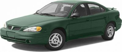 Green 1985 coupe with dual grille and 4-door design