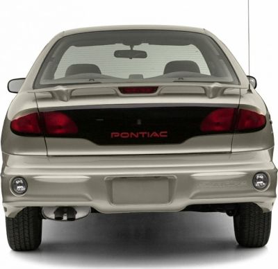 Rear view of a 1995 sedan with spoiler and distinctive taillights