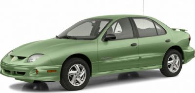 Front side view of green sedan with alloy wheels and sporty front fascia