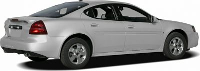 Silver four-door sedan from rear-side perspective