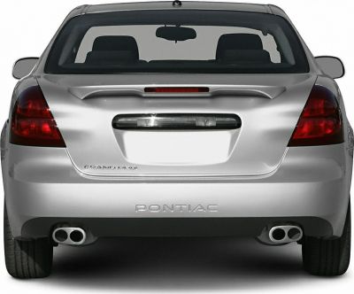 Rear view with spoiler, dual exhaust tips, and distinctive tail lights