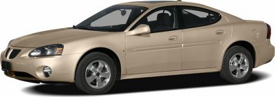Side profile of beige sedan with alloy wheels and smooth design