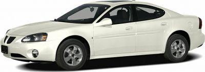 White four-door sedan with alloy wheels and sleek aerodynamic body