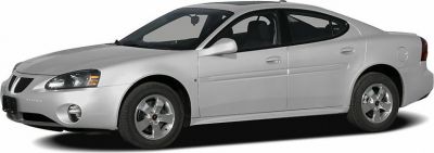 Silver sedan viewed from side with alloy wheels and sleek design.