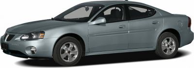 Side profile of a sedan with alloy wheels and fog lights