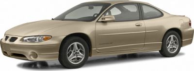 Side profile of two-door coupe with alloy wheels