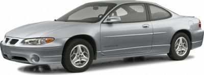 Silver two-door coupe with alloy wheels and sleek aerodynamic profile
