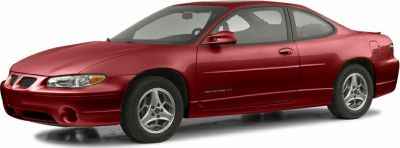 Red 2-door coupe with sporty design and alloy wheels