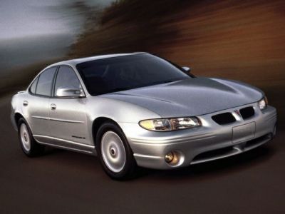 Silver sedan with aerodynamic front and alloy wheels