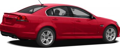 Rear side view of sedan with rear spoiler and alloy wheels