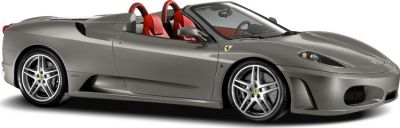 Silver convertible sports car with red seats and alloy wheels side view