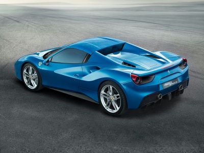 Blue high-performance sports car with aerodynamic rear and dual exhaust