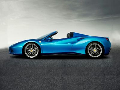 Convertible sports car with aerodynamic side profile and alloy wheels