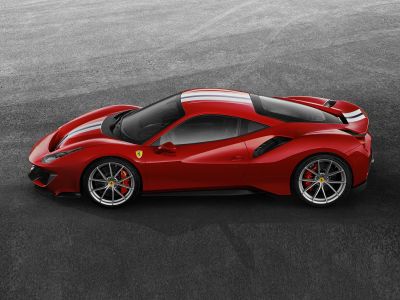 Side profile of a sleek sports car with racing stripes and alloy wheels