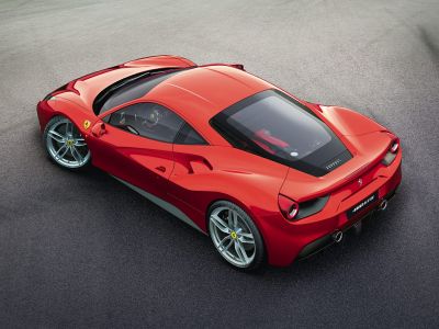 Rear and side view showing aerodynamic sportscar design and rear engine bay.
