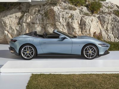 Convertible sports car side profile with sleek design and alloy wheels