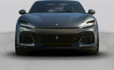 Sleek front headlights and aerodynamic bumper with Ferrari badge