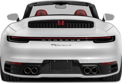 Quad exhaust tips and slim LED tail light on convertible sports car rear