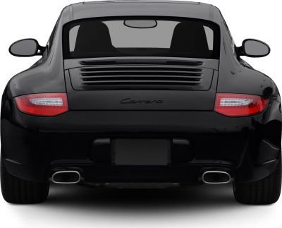 Rear view with Carrera badge, taillights, and dual exhausts