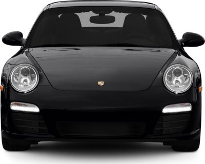 Front view with round headlights and LED daytime running lights.