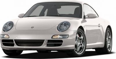 White sports coupe with round headlights and alloy wheels