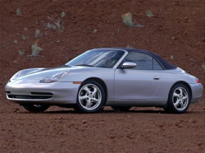Convertible silver coupe with soft top and aerodynamic design