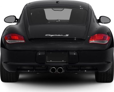Rear view showing taillights and dual central exhaust of a sports coupe