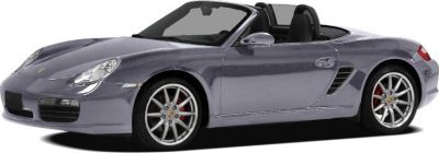 Front-side view of a convertible sports roadster with distinctive headlights.