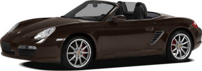 Side view of a convertible sports car with sleek design and alloy wheels.
