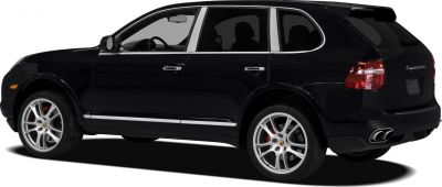 Black SUV side view with alloy wheels and quad exhausts