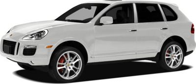White SUV with alloy wheels and red brake calipers.