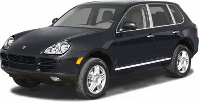 Front side view of SUV with distinct headlights and grille