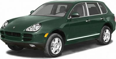 Green SUV with distinct headlights, alloy wheels, and chrome window trim