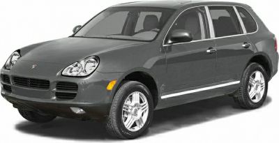 Front right angle of luxury SUV with distinctive headlights and alloy wheels