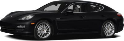 Black four-door luxury sedan with alloy wheels, side profile.