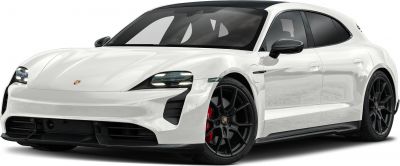 Sleek front headlights and aerodynamic side profile of a white electric hatchback.