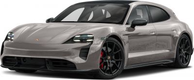 Sleek front view with headlights and sporty black alloy wheels