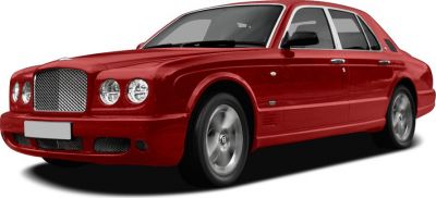 Red luxury sedan front side view with round headlights and mesh grille