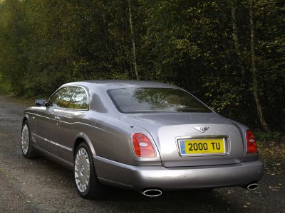 Luxury coupe rear, classic taillights, dual exhaust