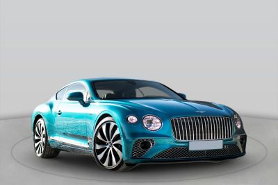 Oval headlights, vertical grille, aerodynamic luxury sports coupe front