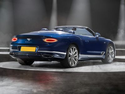 Convertible rear with oval tail lights and dual exhaust pipes