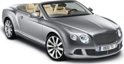 Silver convertible luxury vehicle with mesh grille and alloy wheels