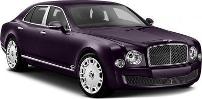 Luxury sedan with chrome mesh grille, round headlights, and distinctive multi-spoke wheels