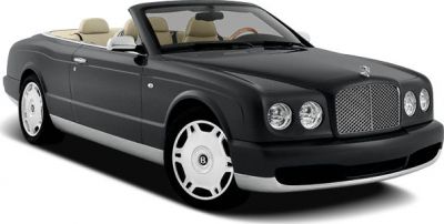 Luxury convertible with chrome mesh grille and round headlights