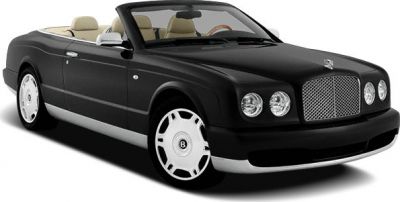 Black luxury convertible with open roof and classic front grille