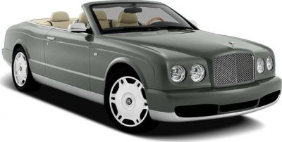 Convertible luxury car with dual round headlights and classic mesh grille