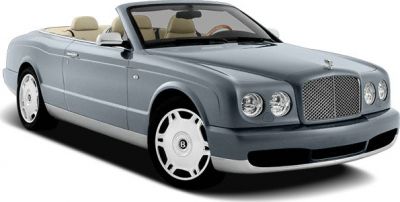 Convertible luxury car with distinctive front grille and beige interior