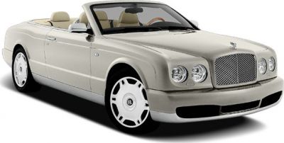 Convertible luxury car with prominent grille and round headlights