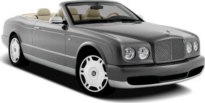 Luxury convertible with iconic front grille and round headlights.