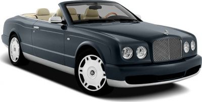 Convertible luxury car with prominent front grille and four round headlights